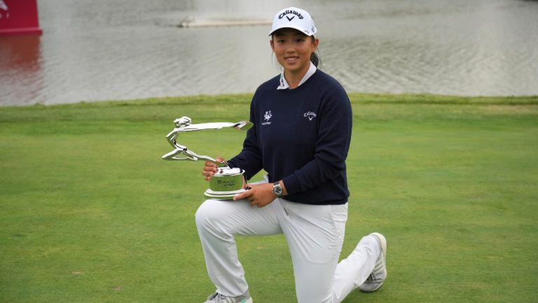 Ruoning Yin of China poses for photos with her trophy after winning the LPGA Shanghai golf tournament at China's Shanghai Qizhong Garden Golf Club, Sunday, Oct. 13, 2024. (Achmad Ibrahim/AP)