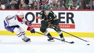 Minnesota Wild left wing Kirill Kaprizov (97) skates with the puck as Montreal Canadiens defenceman Mike Matheson (8) defends during the second period of an NHL hockey game Thursday, Nov. 14, 2024, in St. Paul, Minn. (Matt Krohn/AP)