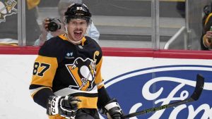 Pittsburgh Penguins' Sidney Crosby (87) celebrates after getting his 600th career goal in the NHL during the second period of an NHL hockey game against the Utah Hockey Club, Saturday, Nov. 23, 2024, in Pittsburgh. (Gene J. Puskar/AP)