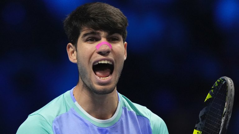 Spain's Carlos Alcaraz celebrates after winning the singles tennis match of the ATP World Tour Finals against Russia's Andrey Rublev, at the Inalpi Arena, in Turin, Italy, Wednesday, Nov. 13, 2024. (Antonio Calanni/AP)