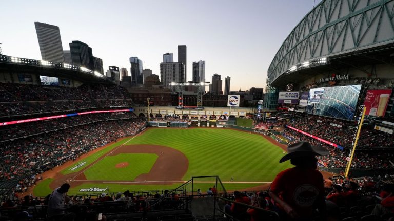 Fans arrive at Minute Maid Park where the roof on the stadium was open for Game 2 of baseball's World Series between the Houston Astros and the Atlanta Braves, Oct. 27, 2021, in Houston. (Ashley Landis/AP)