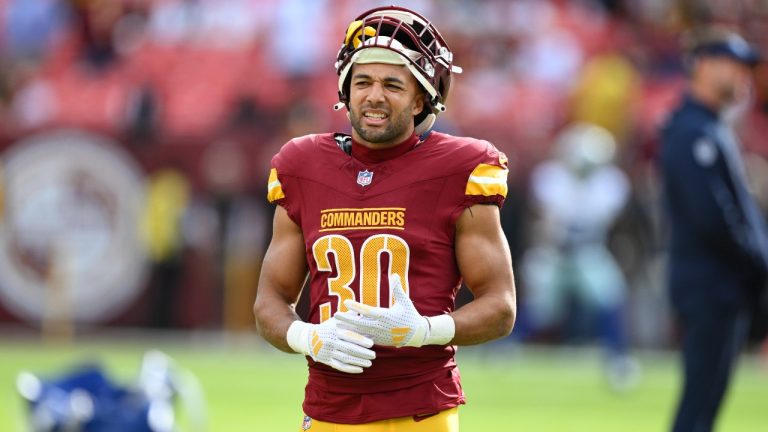 Washington Commanders running back Austin Ekeler (30) looks on during pre-game warm-ups before an NFL football game against the Dallas Cowboys, Sunday, Nov. 24, 2024, in Landover, Md. (AP Photo/Terrance Williams)