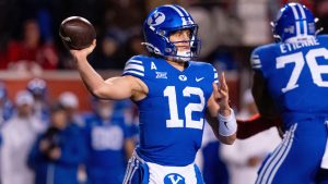 BYU quarterback Jake Retzlaff passes in the first half of an NCAA college football game against Utah, Saturday, Nov. 9, 2024, in Salt Lake City. (Spenser Heaps/AP)