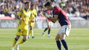 Barcelona's Robert Lewandowski, right, reacts after missing a chance to score a goal against Las Palmas during a Spanish La Liga soccer match at the Lluis Companys Olympic Stadium in Barcelona, Spain, Saturday Nov. 30, 2024. (Joan Monfort/AP)
