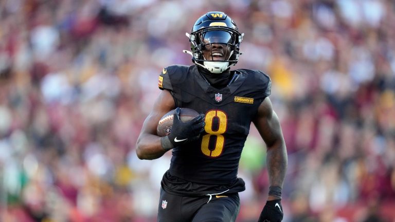 Washington Commanders running back Brian Robinson Jr. (8) carries the ball against the Chicago Bears in the first half of an NFL football game Sunday, Oct. 27, 2024, in Landover, Md. (AP/Stephanie Scarbrough)