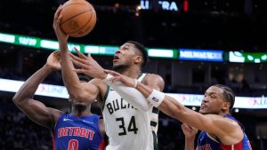 Detroit Pistons' Wendell Moore Jr. fouls Milwaukee Bucks' Giannis Antetokounmpo during the second half of an NBA basketball game Wednesday, Nov. 13, 2024, in Milwaukee. (AP Photo/Morry Gash)