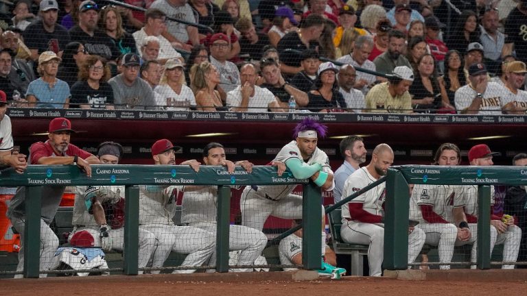 Arizona Diamondbacks players watch during the second inning after the San Diego Padres take a 1-0 lead during a baseball game Sunday, Sept. 29, 2024, in Phoenix. (AP Photo/Darryl Webb)