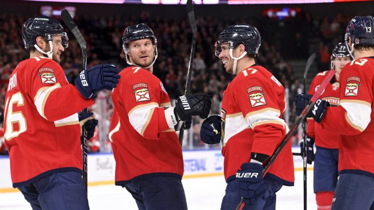 Florida Panthers players, from left, Aleksander Barkov , Dmitry Kulikov, Evan Rodrigues, Niko Mikkola (77), and Sam Reinhart (13) celebrate after Rodrigues' scored a goal against the Dallas Stars during an NHL hockey game, Saturday, Nov. 2, 2024, in Tampere, Finland. (Heikki Saukkomaa/Lehtikuva via AP) 