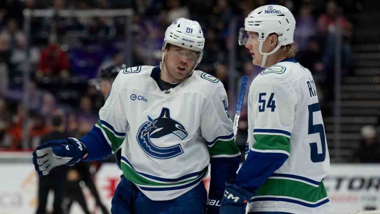 Vancouver Canucks right wing Daniel Sprong (91) talks with centre Aatu Raty (54) during the second period of an NHL hockey game against the Anaheim Ducks in Anaheim, Calif., Tuesday, Nov. 5, 2024. (Alex Gallardo/AP)