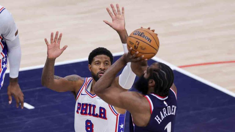 Philadelphia 76ers forward Paul George (8) defends against Los Angeles Clippers guard James Harden (1) during the first half of an NBA basketball game, Wednesday, Nov. 6, 2024, in Inglewood, Calif. (Ryan Sun/AP)