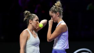 Canada's Gabriela Dabrowski, left, talks to New Zealand's Erin Routliffe during their match against Taylor Townsend of the U.S. and Katerina Siniakova of the Czech Republic in the women's doubles final of the WTA finals at King Saud University Indoor Arena, in Riyadh, Saudi Arabia, Saturday, Nov. 9, 2024. (AP) 