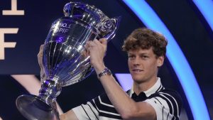 Italy's Jannik Sinner holds the trophy as ATP world best player at the ATP World Tour Finals at the Inalpi Arena, in Turin, Italy, Monday, Nov. 11, 2024. Sinner was presented with the trophy for finishing the year ranked No. 1. (Antonio Calanni/AP)