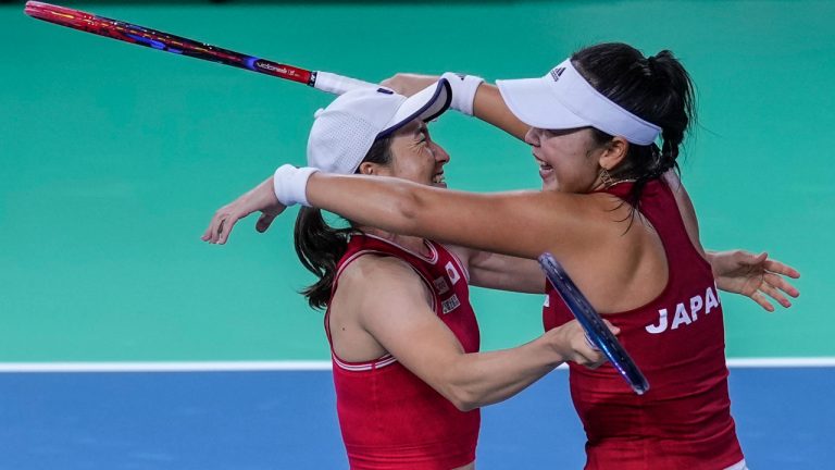 Japan's Shuko Aoyama, right, and Eri Hozumi celebrate winning their doubles match against Romania's Monica Niculescu and Elena Gabriela at the Billie Jean King Cup Finals, at the Martin Carpena Sports Hall, in Malaga, southern Spain, on Thursday, Nov. 14, 2024. (AP Photo/Manu Fernandez)