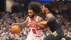 Chicago Bulls' Coby White (0) drives against Cleveland Cavaliers' Donovan Mitchell, right, during the first half of an Emirates NBA Cup basketball game in Cleveland, Friday, Nov 15, 2024. (Phil Long/AP)