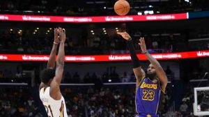 Los Angeles Lakers forward LeBron James (23) shots a 3-point basket against New Orleans Pelicans center Yves Missi (21) in the second half of an NBA basketball game in New Orleans, Saturday, Nov. 16, 2024. The Lakers won 104-99. (Gerald Herbert/AP)