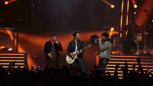 Nick, Kevin and Joe of The Jonas Brothers perform during the halftime show at the 111th Grey Cup in Vancouver, B.C., Sunday, Nov. 17, 2024. (Ethan Cairns/CP)