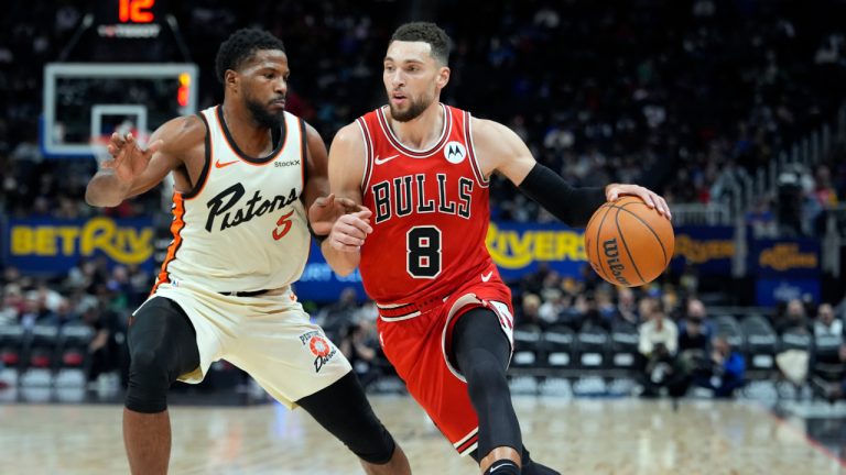 Chicago Bulls guard Zach LaVine (8) drives on Detroit Pistons guard Malik Beasley (5) during the first half of an NBA basketball game, Monday, Nov. 18, 2024, in Detroit. (AP Photo/Carlos Osorio)