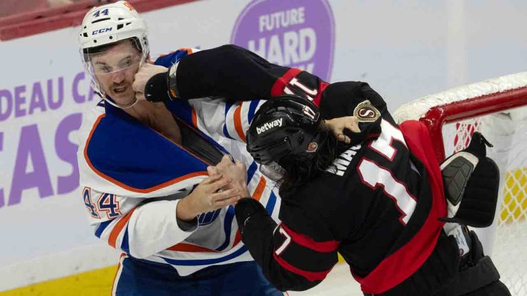 Ottawa Senators right wing Zack MacEwen (17) lands a punch on Edmonton Oilers defenceman Josh Brown (44) as they fight during first period NHL action. (Adrian Wyld/CP)