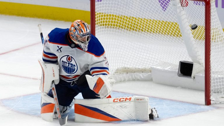 The puck bounces off the post behind Edmonton Oilers goaltender Stuart Skinner during second period NHL action, in Ottawa, Tuesday, Nov. 19, 2024. No goal was scored on the play. (CP/Adrian Wyld)