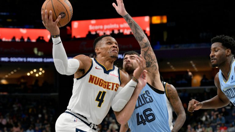 Denver Nuggets guard Russell Westbrook (4) drives against Memphis Grizzlies guard John Konchar (46) in the second half of an Emirates NBA Cup basketball game Tuesday, Nov. 19, 2024, in Memphis, Tenn. (AP Photo/Brandon Dill)