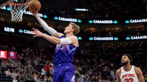 Utah Jazz forward Lauri Markkanen goes to the hoop ahead of New York Knicks centre Karl-Anthony Towns (32) during the second half of an NBA basketball game, Saturday, Nov. 23, 2024, in Salt Lake City. (Spenser Heaps/AP)