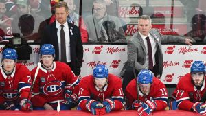 Montreal Canadiens head coach Martin St-Louis, right, and assistant coach Trevor Letowski, left, and players look on from the bench during third period NHL hockey action against the Vegas Golden Knights in Montreal, Saturday, November 23, 2024. (Graham Hughes/CP)