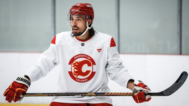 Calgary Flames' Ryan Lomberg (70) looks on during a training camp practice session in Calgary, Thursday, Sept. 19, 2024. (Jeff McIntosh/CP)