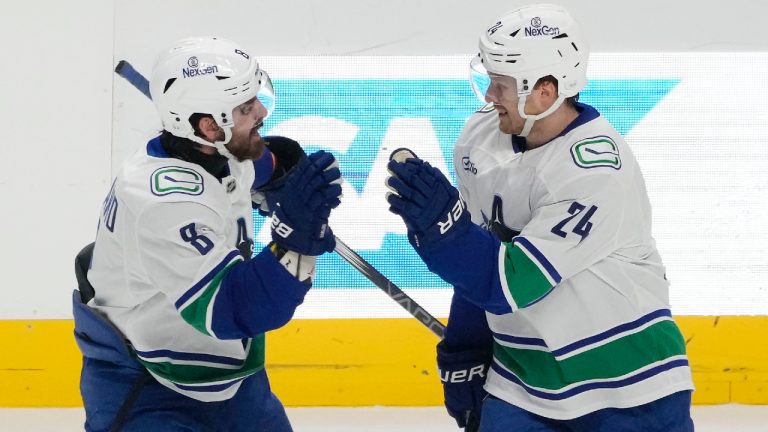 Vancouver Canucks centre Pius Suter (24) celebrates with right wing Conor Garland (8) after scoring a goal against the San Jose Sharks during the third period of an NHL hockey game in San Jose, Calif., Saturday, Nov. 2, 2024. (AP)