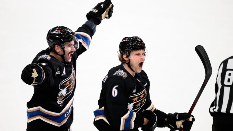 Washington Capitals defenseman Jakob Chychrun (6) celebrates his game-winning goal with right wing Tom Wilson (43) during overtime of an NHL hockey game against New York Islanders goaltender Semyon Varlamov (40). (Nick Wass/AP)