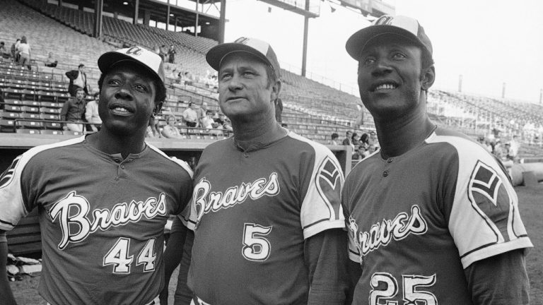 Atlanta Braves' Rico Carty, right, Hank Aaron, left, and Lew Burdette look up into stands on May 22, 1972 before an exhibition game against the Brewers in Milwaukee. (File/AP)