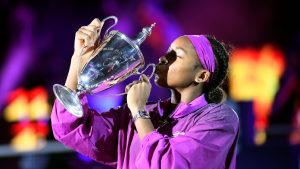 Coco Gauff of the U.S. kisses her trophy after winning against China's Qinwen Zheng in their women's singles final match of the WTA finals at the King Saud University Indoor Arena, in Riyadh, Saudi Arabia, Saturday, Nov. 9, 2024. (AP)