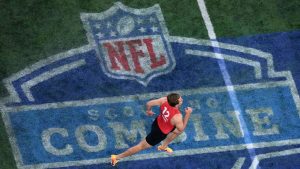 Brigham Young quarterback Kedon Slovis warms up before running the 40-yard dash during the NFL football scouting combine, Saturday, March 2, 2024, in Indianapolis. (Charlie Riedel/AP)