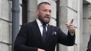 Conor McGregor gestures as he leaves the High Court in Dublin, Ireland Wednesday, Nov. 6, 2024. (Brian Lawless/PA via AP)