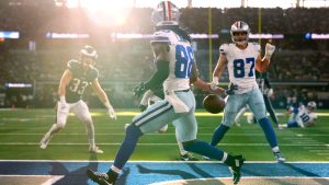 Dallas Cowboys wide receiver CeeDee Lamb runs past a pass thrown into the end zone by quarterback Cooper Rush as Philadelphia Eagles' Cooper DeJean (33) and Jake Ferguson (87) look on in the first half of an NFL football game in Arlington, Texas, Sunday, Nov. 10, 2024. (Jeffrey McWhorter/AP)