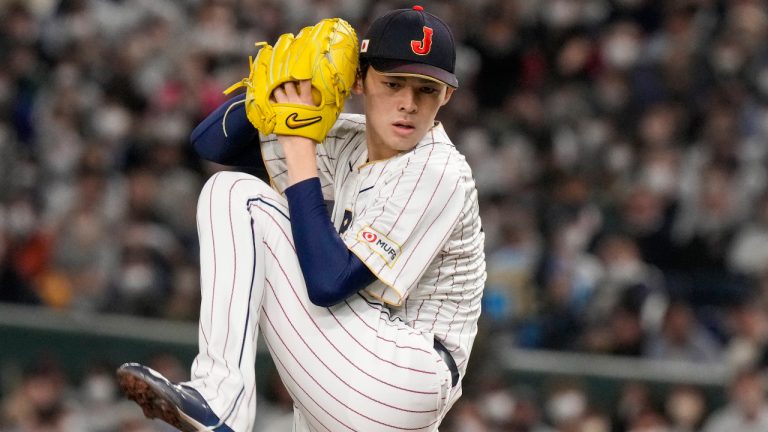 FILE - Roki Sasaki of Japan pitches during their Pool B game against the Czech Republic at the World Baseball Classic at the Tokyo Dome in Tokyo, on March 11, 2023. (Eugene Hoshiko/AP)