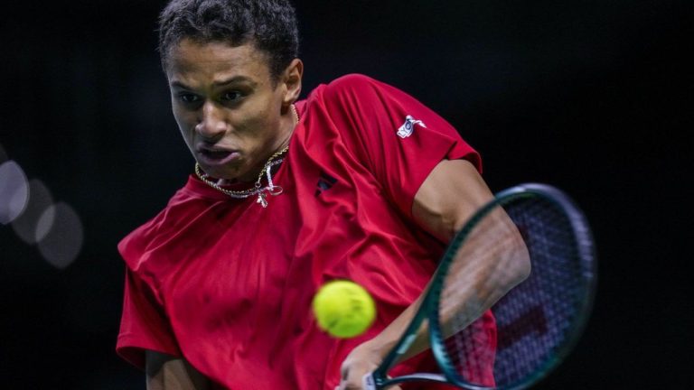 Canada's Gabriel Diallo returns the ball against Germany's Daniel Altmaier during a Davis Cup quarterfinal match at the Martin Carpena Sports Hall, in Malaga, southern Spain, on Wednesday, Nov. 20, 2024. (Manu Fernandez/AP)
