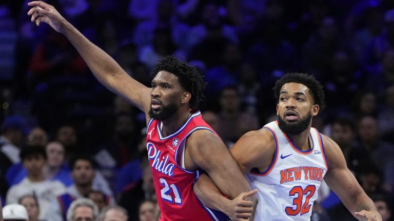 Philadelphia 76ers' Joel Embiid, left, and New York Knicks' Karl-Anthony Towns struggle for position during the first half of an Emirates NBA Cup basketball game, Tuesday, Nov. 12, 2024, in Philadelphia. (Matt Slocum/AP)