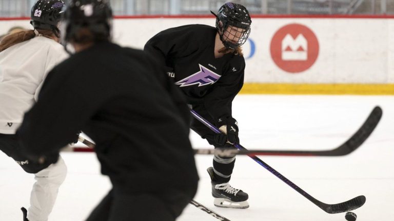 Minnesota Frost defender Claire Thompson (42) controls the puck during a PWHL hockey practice Thursday, Nov. 14, 2024 at TRIA Rink in St. Paul, Minn. (Anthony Souffle/Star Tribune via AP)
