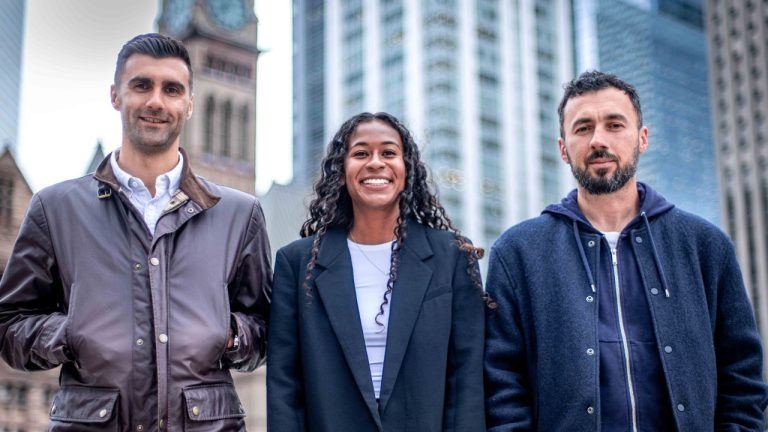 Newly signed AFC Toronto defender Croix Soto is flanked by sporting director Billy Wilson, left, and head coach Marko Milanovic outside Old City Hall in Toronto, Tuesday, Nov. 19, 2024. (HO-CREO Vision/CP)