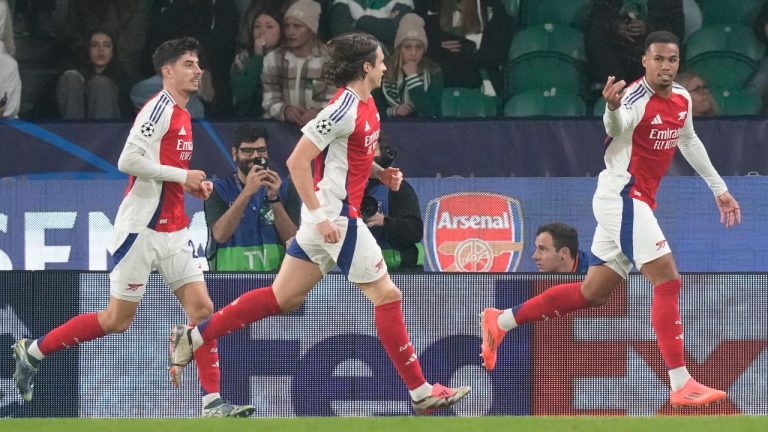 Arsenal's Gabriel, right, celebrates after scoring his side's third goal against Sporting during the Champions League opening phase match at the Alvalade stadium in Lisbon, Tuesday, Nov. 26, 2024. (AP/Armando Franca)