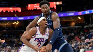 Philadelphia 76ers guard Tyrese Maxey (0) handles the ball against Memphis Grizzlies forward Jaren Jackson Jr. in the second half of an NBA basketball game Wednesday, Nov. 20, 2024, in Memphis, Tenn. (AP Photo/Brandon Dill)