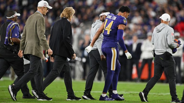 Baltimore Ravens safety Kyle Hamilton (14) walks off the field with trainers after an injury during the first half of an NFL football game against the Cincinnati Bengals, Thursday, Nov. 7, 2024, in Baltimore. (Terrance Williams/AP)