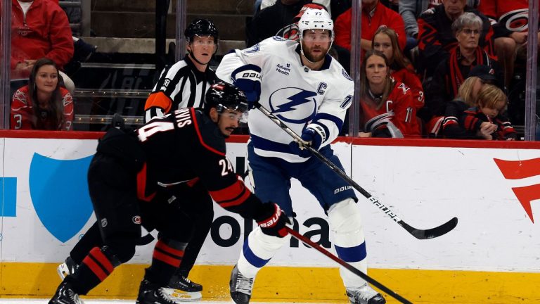 Tampa Bay Lightning's Victor Hedman (77) clears the puck past Carolina Hurricanes' Seth Jarvis (24) during the first period of an NHL hockey game in Raleigh, N.C., Friday, Oct. 11, 2024. (Karl B DeBlaker/AP)