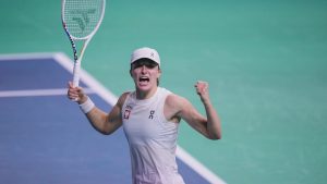 Poland's Iga Swiatek celebrates after beating Spain's Paula Badosa during the Billie Jean King Cup Finals, at the Martin Carpena Sports Hall, in Malaga, southern Spain, on Friday, Nov. 15, 2024. (AP Photo/Manu Fernandez)