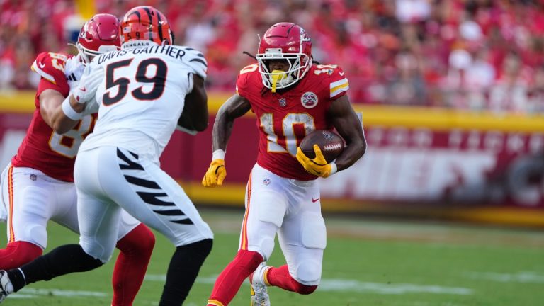 Kansas City Chiefs running back Isiah Pacheco runs with the ball as Cincinnati Bengals linebacker Akeem Davis-Gaither defends during the first half of an NFL game Sunday, Sept. 15, 2024, in Kansas City, Mo. (AP/Charlie Riedel)