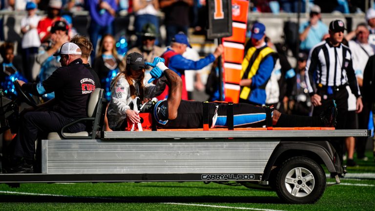 Carolina Panthers tight end Ja'Tavion Sanders (0) is helped by staff after injury during the first half against the Kansas City Chiefs, Sunday, Nov. 24, 2024, in Charlotte, N.C. (Jacob Kupferman/AP)