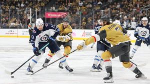 Winnipeg Jets centre Gabriel Vilardi (13) skates against Vegas Golden Knights centre Brett Howden (21) and defenceman Alex Pietrangelo (7) during the third period of an NHL hockey game Friday, Nov. 29, 2024, in Las Vegas. (Ian Maule/AP)