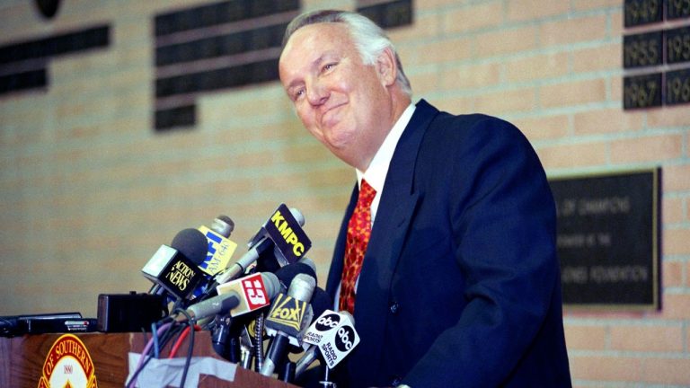 Former head coach of the Los Angeles Rams John Robinson addresses the media in Los Angeles, Jan. 3, 1992. (AP Photo/Chris Martinez, File)