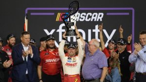 Justin Allgaier celebrates after winning the championship after a NASCAR Xfinity Series auto race, Saturday, Nov. 9, 2024, in Avondale, Ariz. (John Locher/AP)