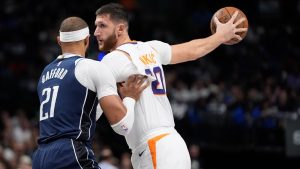 Phoenix Suns centre Jusuf Nurkic keeps the ball from Dallas Mavericks centre Daniel Gafford during the first half of an NBA game Friday, Nov. 8, 2024, in Dallas. (AP)